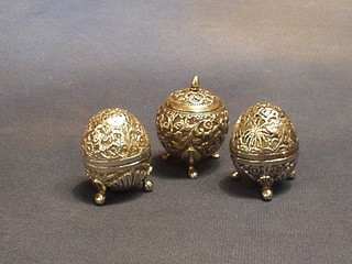 3 Eastern embossed silver pepperettes