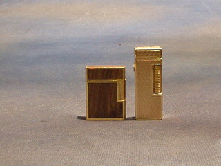 2 gold coloured lighters