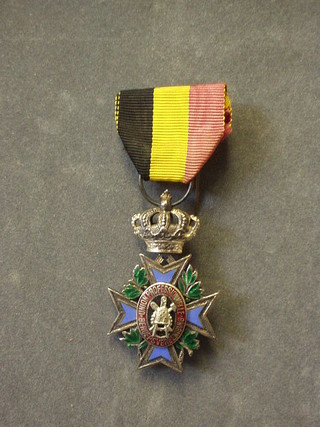 A Continental Industrial service medal in the form of an 8 pointed enamelled cross, the centre decorated a compass, spade and beehive, hung a black, yellow and salmon pink ribbon