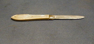 A Victorian silver bladed folding fruit knife with carved mother of handle, decorated Prince of Wales feathers, Sheffield 1894
