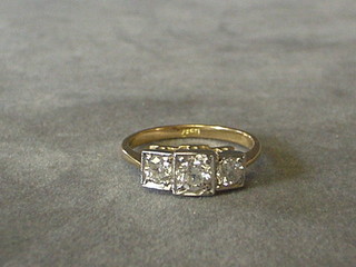 A lady's Art Deco style gold dress ring set 3 diamonds