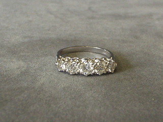 A lady's white gold engagement ring set 5 diamonds and 6 small diamonds to the shoulders (approx. 1.35ct)