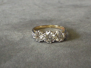 A lady's 18ct gold engagement ring set 3 diamonds and 6 diamonds to the shoulders (approx 0.22/1.71ct)