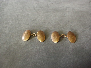 A pair of 9ct gold oval cufflinks, engraved