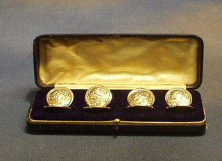 A set of 4 Edwardian Art Nouveau silver place card holders, engraved head and shoulders of a lady amidst flowers, Birmingham 1905, cased