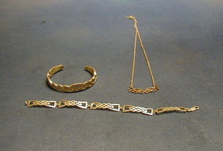 A suite of modern silver pierced jewellery comprising bracelet, bangle and necklace