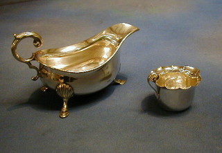 A silver plated sauce boat and a do. cream jug