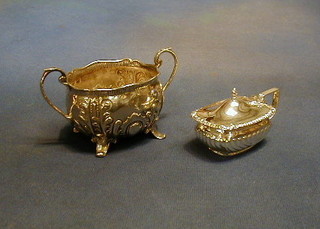 A Victorian embossed silver twin handled sugar bowl raised on panel supports, Birmingham 1891 and a silver mustard pot 4 ozs