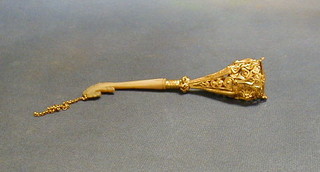 A gilt metal posy holder