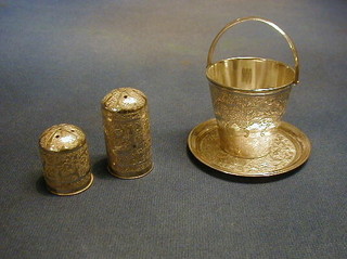 A Persian miniature silver twin handled beaker 2", a miniature tray 3" and 2 pepper pots