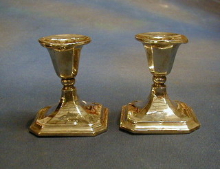 A pair of shaped silver candlesticks, Birmingham 1921 by Walker & Hall (f) 4"