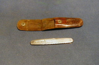 A silver pen knife contained in a leather case