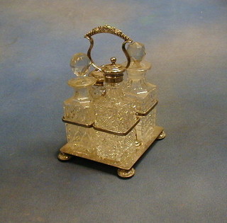 A silver plated 4 bottle cruet