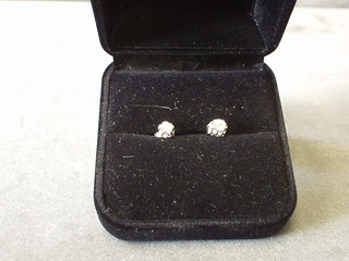 A pair of lady's diamond stud earrings