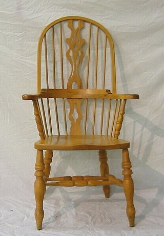 A beech framed Windsor carver chair on turned supports