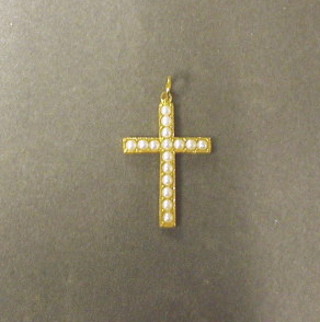 A 9ct gold cross set seed pearls