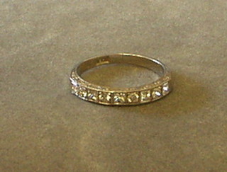 A lady's white gold half eternity ring set 9 diamonds