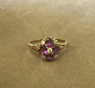 A lady's gold dress ring set oval cut amethysts and  5 diamonds