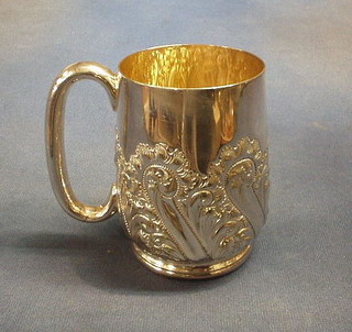 An embossed silver plated tankard