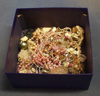 A collection of costume jewellery and a cut glass scent