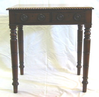 A 19th Century mahogany rectangular side table with gadrooned decoration, fitted 2 frieze drawers and raised on turned supports 28"