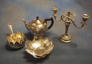 A circular silver plated tea service with teapot, hotwater jug, sugar bowl and cream jug and sundry silver plated items