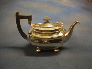 A Georgian style silver plated teapot, raised on 3 bun feet by Walker & Hall