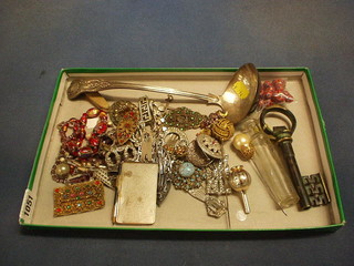 A bronzed corkscrew in the form of a key, a silver plated Queens Pattern ladle and a collection of costume jewellery