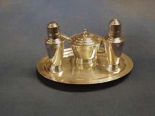 An Art Deco silver plated 4 piece condiment set with tray, mustard pot, pepper and salt by Mappin & Webb