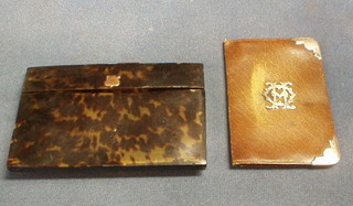 A tortoiseshell purse with gold mounts 5" and a leather wallet with silver mounts (2)