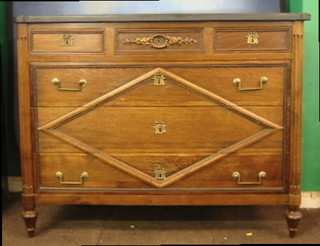 A fine quality 19th Century French walnutwood commode with black veined marble top, fitted 3 short and 3 long drawers, with fluted column decoration to the sides, 50"