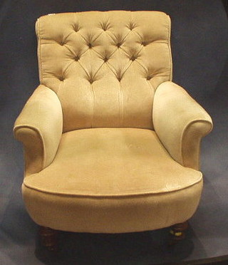 A Victorian mahogany framed armchair upholstered mushroom buttoned material