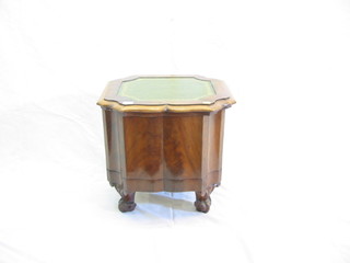 A Victorian walnutwood step commode of serpentine outline complete with china liner, raised on French cabriole supports 19"