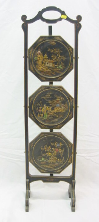 A 1930's black lacquered 3 tier folding cake stand with chinoiserie decoration