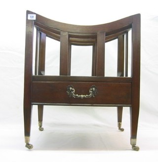 A 19th Century mahogany 3 section Canterbury, the base fitted a drawer and raised on square tapering supports ending in brass caps and castors 19"