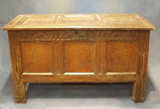 A 17th/18th Century oak coffer of panelled construction with hinged lid, the interior fitted a candle box 41"