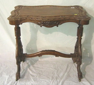 A Victorian rectangular carved walnutwood stretcher table, raised on pierced and bulbous turned supports 30"