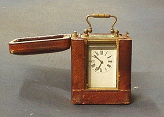 A 19th Century miniature French carriage clock with enamelled dial contained in a gilt metal case 3" complete with carrying case