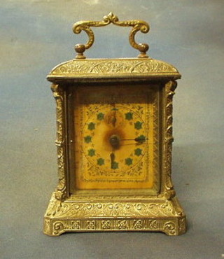 A 19th Century French 8 day timepiece with painted dial and Arabic numerals contained in an ornate metal case 6" (requires some attention)