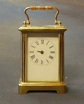 A 19th Century French carriage timepiece with enamelled dial (hands f), the base marked R and C, 4 1/2"