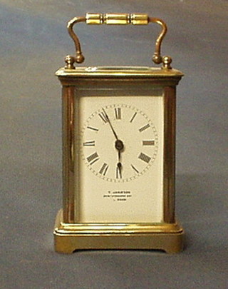 A 19th Century French carriage clock with enamelled dial and Roman numerals by T Jamieson of 94 Westbourne Grove, London, 4 1/2"