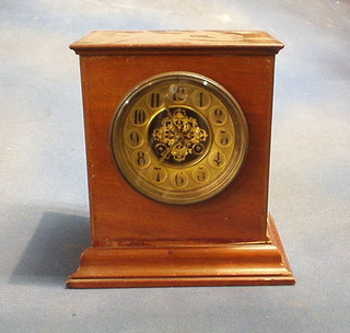 A French Edwardian 8 day striking mantel clock with gilt dial and Arabic numerals, contained in a walnutwood case 