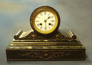 A French Victorian 8 day striking mantel clock contained in a black veined marble drum case, supported on a scroll base