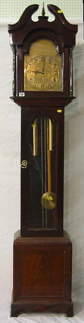 A 20th Century 8 day striking longcase clock, the 10" brass arched dial with Arabic numerals contained in a mahogany case 75"