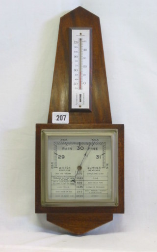 An aneroid barometer and thermometer with square silvered dial contained in a mahogany case