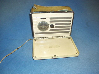 A G Marconi portable radio contained in a white Bakelite case 7"