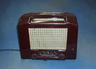 An Ecko radio contained in a brown Bakelite case with carrying handle (rear panel f)