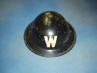 A WWII air raid wardens steel helmet