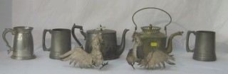 A Britannia metal teapot, 2 silver plated figures of fighting cocks, 3 pewter tankards and an Eastern brass kettle
