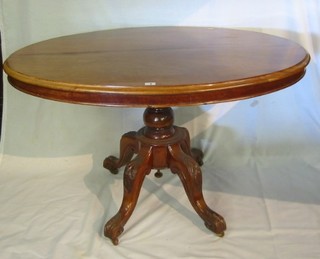 A Victorian mahogany oval Loo table, raised on tripod supports